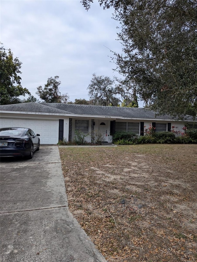 ranch-style home featuring a garage