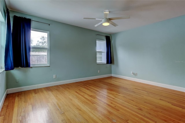 spare room with ceiling fan and light hardwood / wood-style flooring