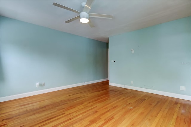 empty room featuring ceiling fan and light hardwood / wood-style flooring