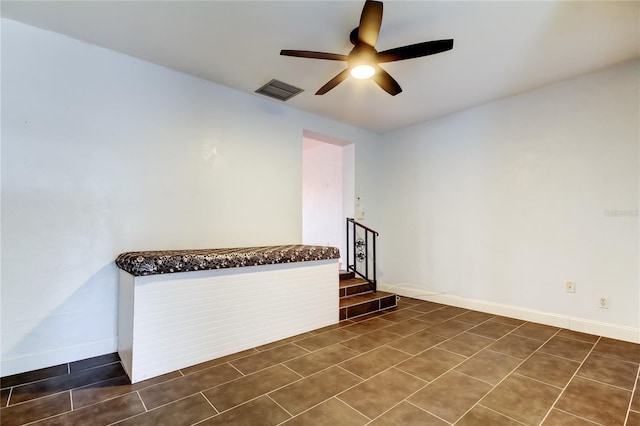 interior space featuring ceiling fan