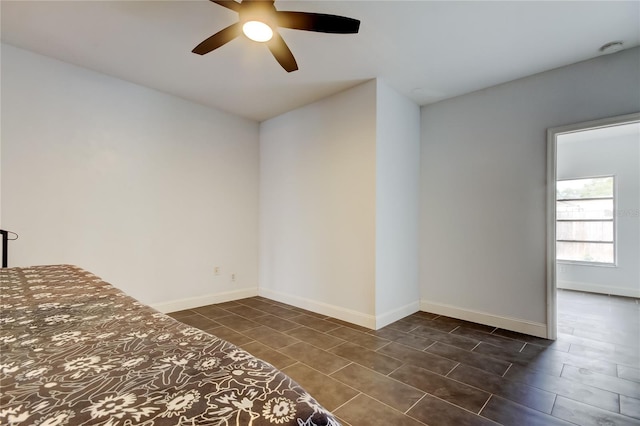 unfurnished bedroom featuring ceiling fan