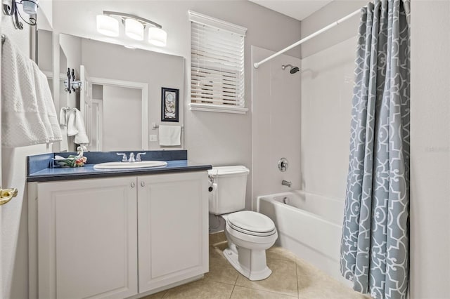 full bathroom with toilet, vanity, tile patterned floors, and shower / bath combo with shower curtain