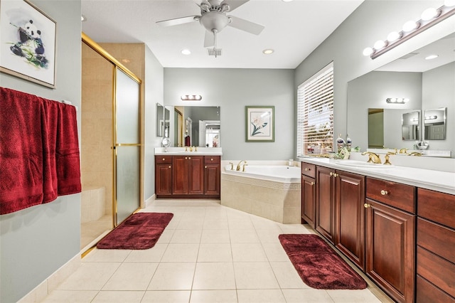 bathroom featuring ceiling fan, vanity, tile patterned flooring, and independent shower and bath