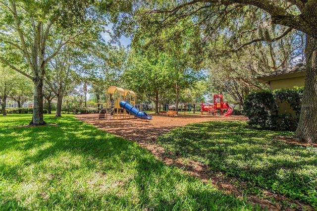 view of jungle gym with a lawn