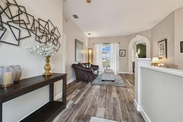 corridor with hardwood / wood-style floors