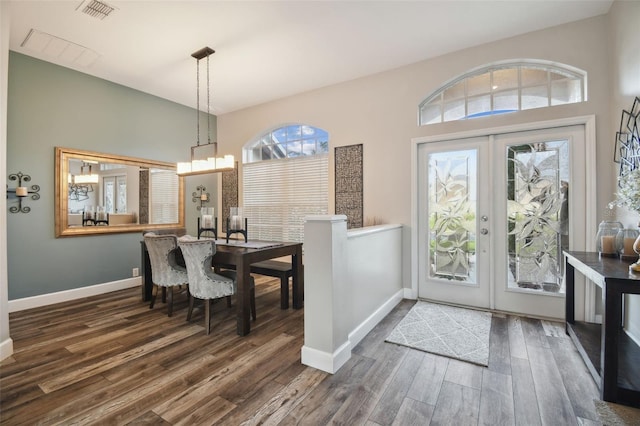 foyer entrance featuring french doors and dark hardwood / wood-style flooring