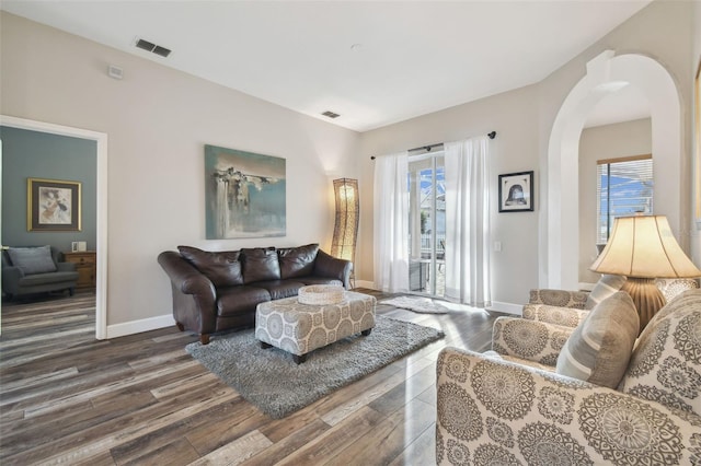 living room featuring dark hardwood / wood-style flooring