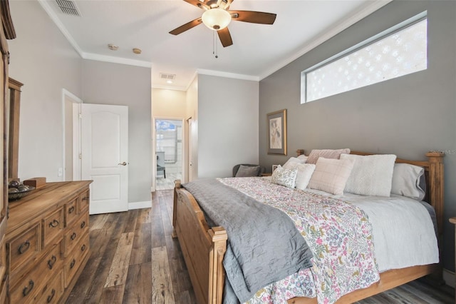 bedroom with ceiling fan, dark wood-type flooring, crown molding, and ensuite bathroom