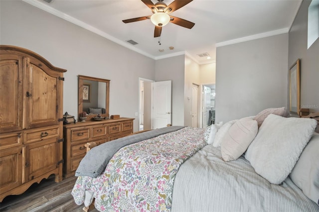 bedroom with ceiling fan, crown molding, connected bathroom, and dark hardwood / wood-style floors