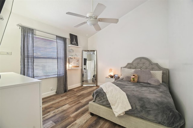 bedroom with ceiling fan, dark hardwood / wood-style floors, and lofted ceiling