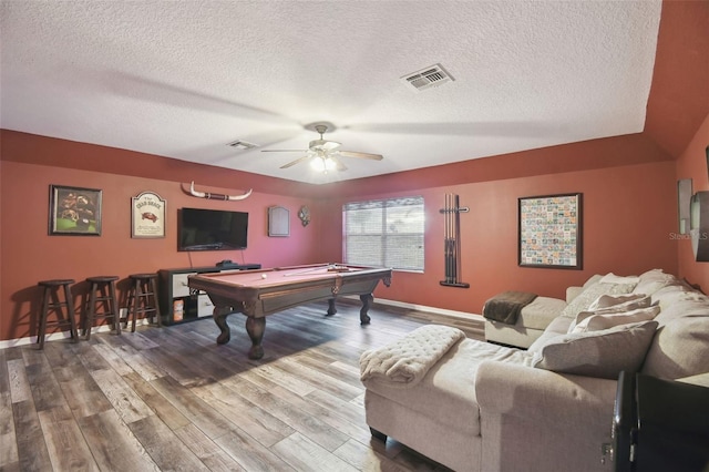 rec room with ceiling fan, wood-type flooring, pool table, and a textured ceiling