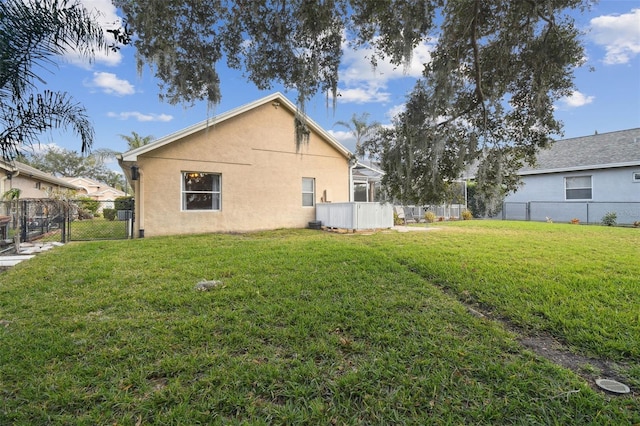 view of side of home featuring a lawn