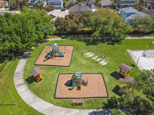 view of community featuring a lawn and a playground