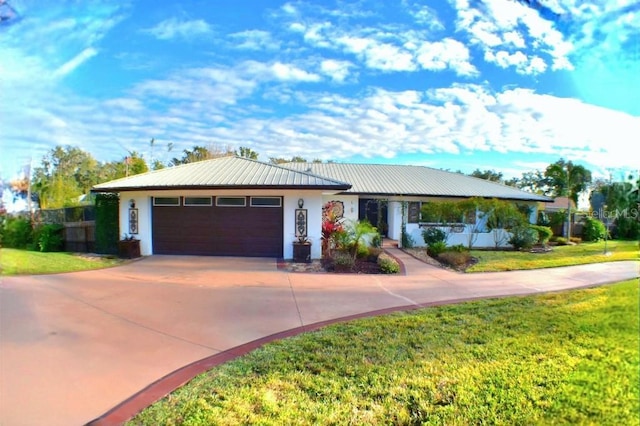 ranch-style home with a garage and a front lawn