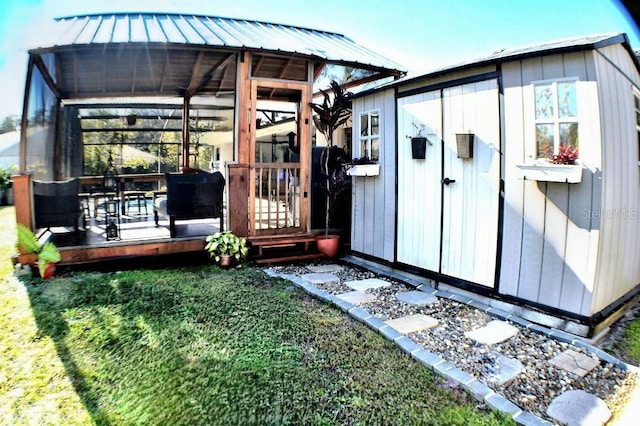 view of outbuilding featuring a lawn