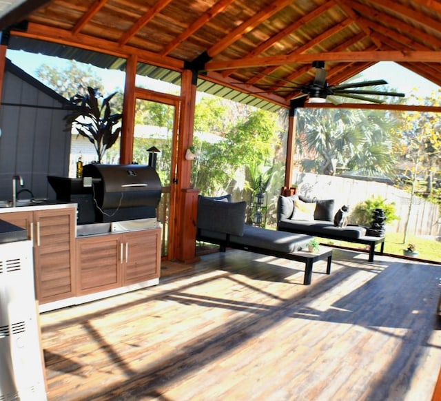 wooden deck with a grill, a gazebo, and ceiling fan