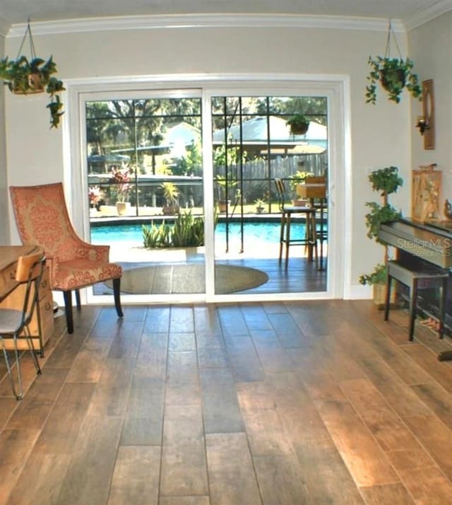 225 Temple Cir, Eustis, FL 32726 - entryway featuring wood-type flooring and crown molding