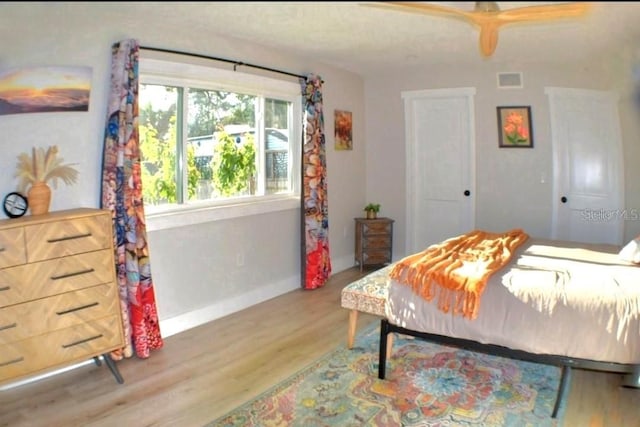 225 Temple Cir, Eustis, FL 32726 - bedroom featuring wood finished floors and baseboards