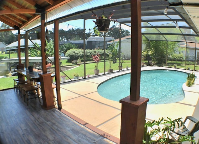 225 Temple Cir, Eustis, FL 32726 - outdoor pool featuring glass enclosure, a lawn, and a patio