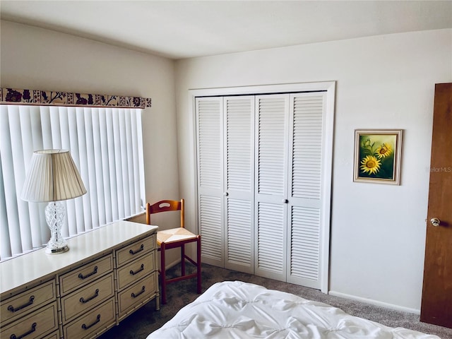 carpeted bedroom featuring a closet