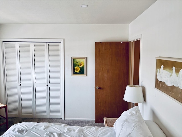 carpeted bedroom with a closet