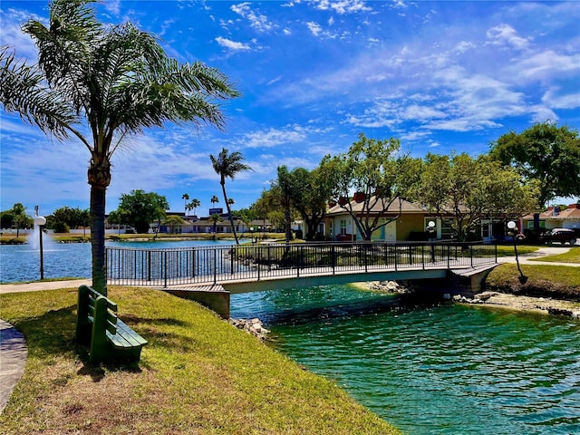 exterior space featuring a water view and a lawn