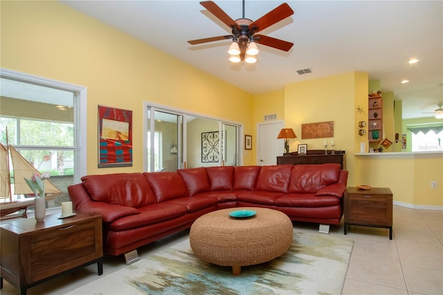 living room with ceiling fan and light tile patterned floors