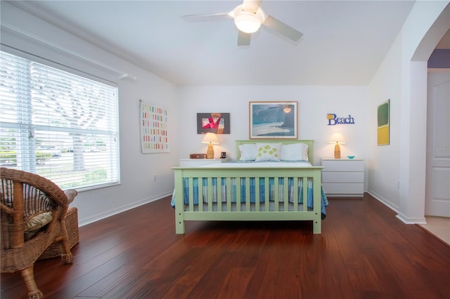 bedroom featuring ceiling fan and dark hardwood / wood-style floors