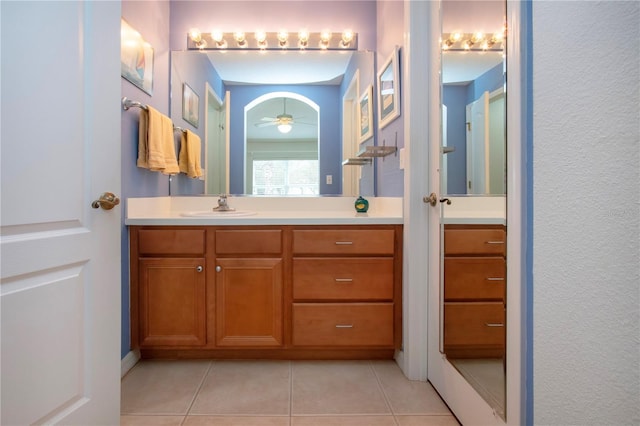 bathroom featuring ceiling fan, tile patterned floors, and vanity