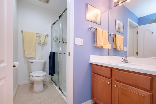 bathroom featuring vanity, toilet, tile patterned floors, and an enclosed shower