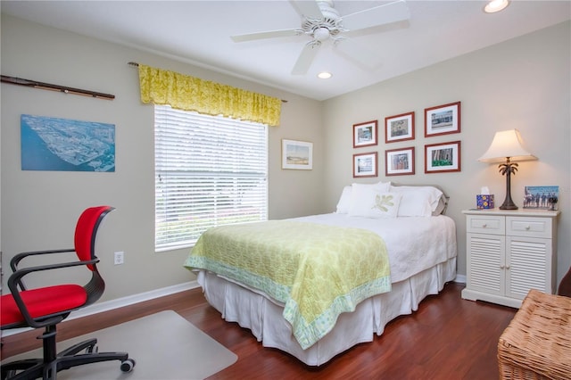 bedroom with ceiling fan and dark hardwood / wood-style flooring