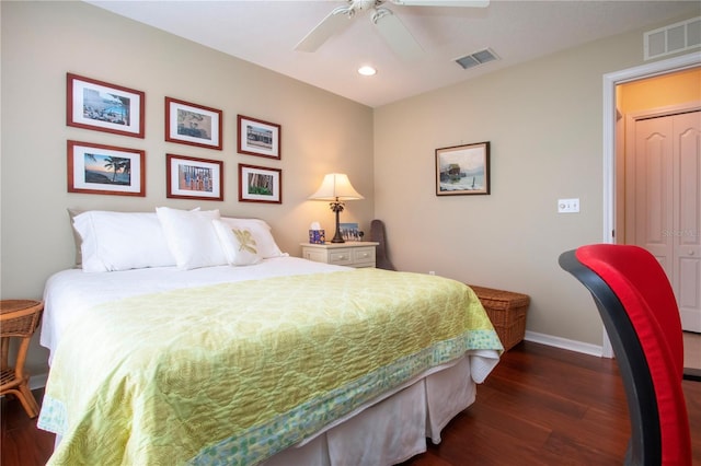 bedroom with ceiling fan, dark hardwood / wood-style floors, and a closet