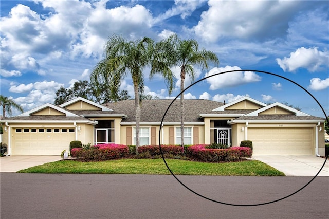 view of front of property with a front lawn and a garage