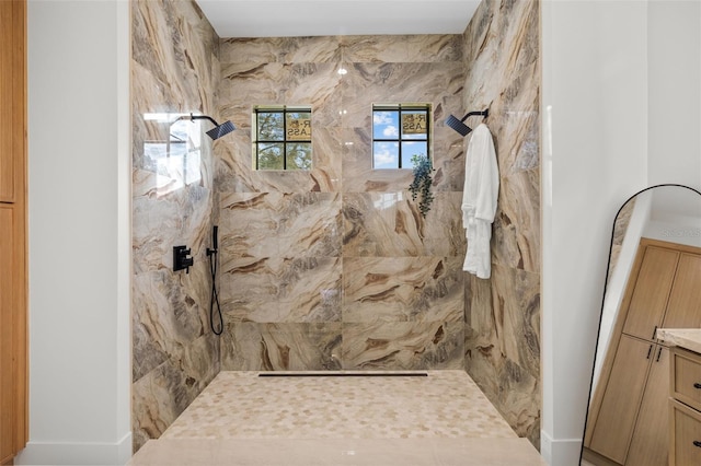 bathroom featuring vanity and a tile shower