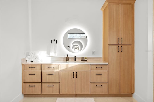 bathroom with tile patterned floors and vanity