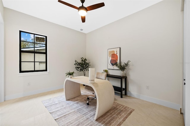 tiled office featuring ceiling fan