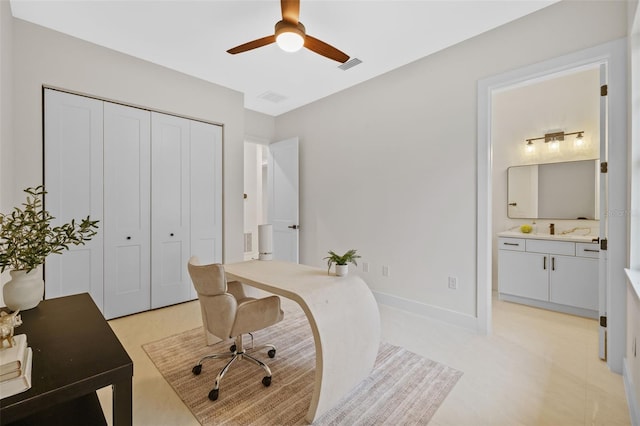 office area featuring ceiling fan and sink