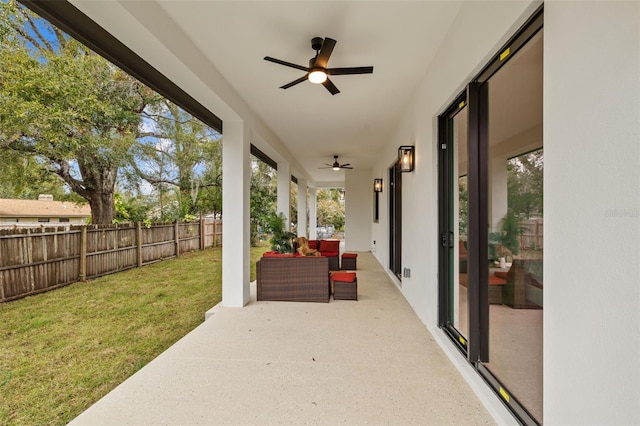 view of patio with an outdoor hangout area and ceiling fan