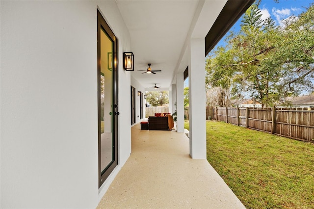 view of patio featuring ceiling fan