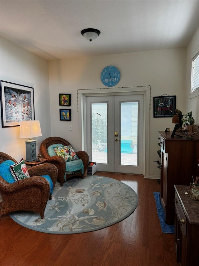 living area featuring wood-type flooring and french doors