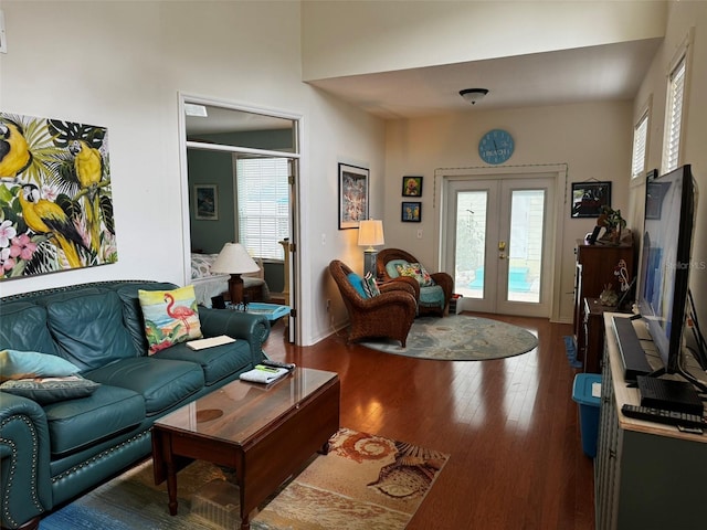 living room with wood-type flooring and french doors