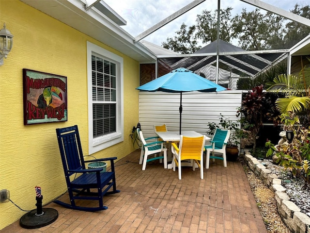 view of patio / terrace with glass enclosure