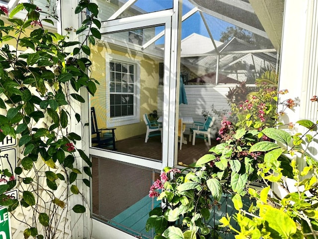 view of patio / terrace featuring a lanai