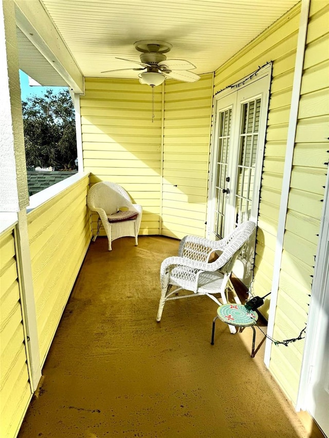 view of patio featuring ceiling fan and french doors