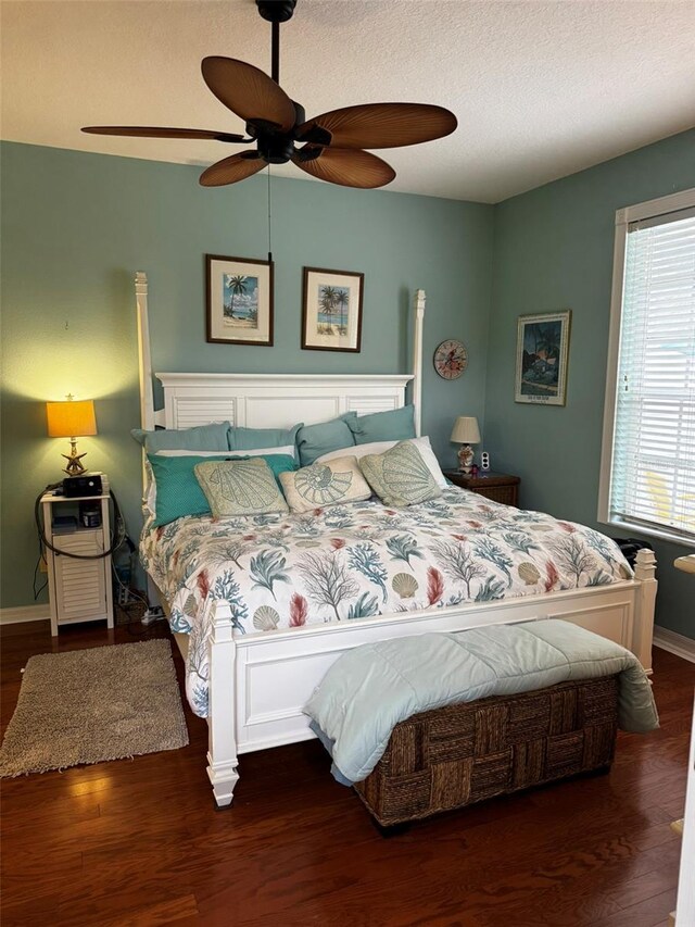 bedroom featuring dark hardwood / wood-style floors and ceiling fan