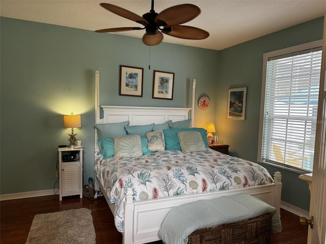 bedroom featuring dark hardwood / wood-style floors and ceiling fan