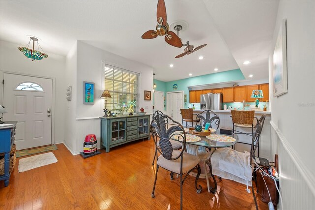 458 Grant St, Dunedin, FL 34698 - dining space with a ceiling fan, light wood-style flooring, recessed lighting, and wainscoting