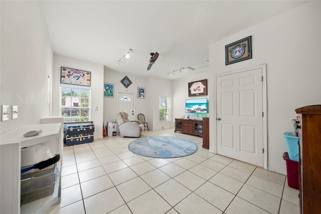 458 Grant St, Dunedin, FL 34698 - foyer featuring rail lighting, plenty of natural light, and light tile patterned floors