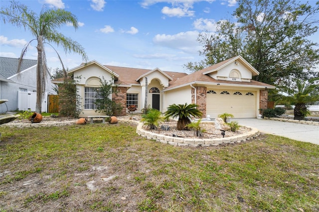 ranch-style house with a front lawn and a garage