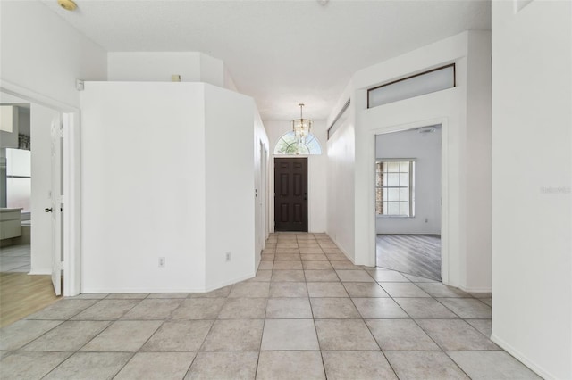 tiled entrance foyer featuring a textured ceiling